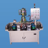 Four shaft tapping machine